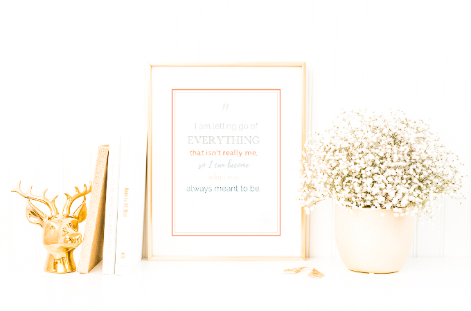 Picture of Framed Positive Affirmation with pot of flowers next to it