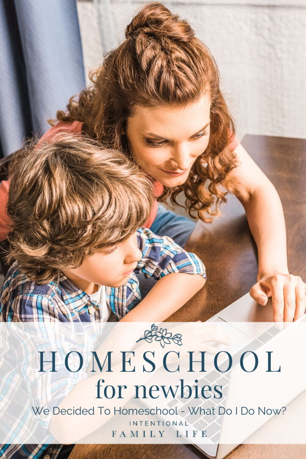 mother and son working together on schoolwork; concept of how to start homeschooling